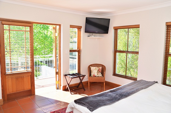 Spacious bedroom with satellite television and private balcony